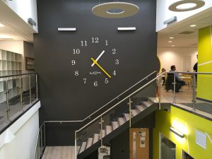 Clock in the stairwell at Derby University